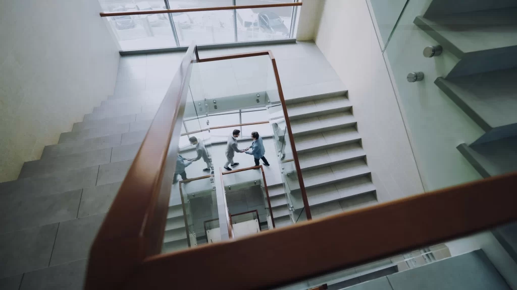 aa 2024 mens handshake on stairs